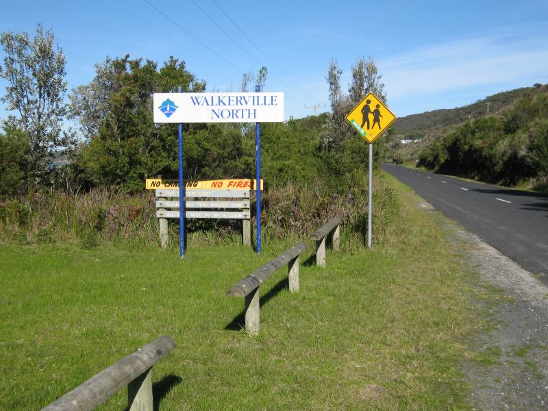 Walkerville - Beach and scenery along coastal section of Bayside Drive: Walkerville North town sign, view south along Bayside Dr near caravan park