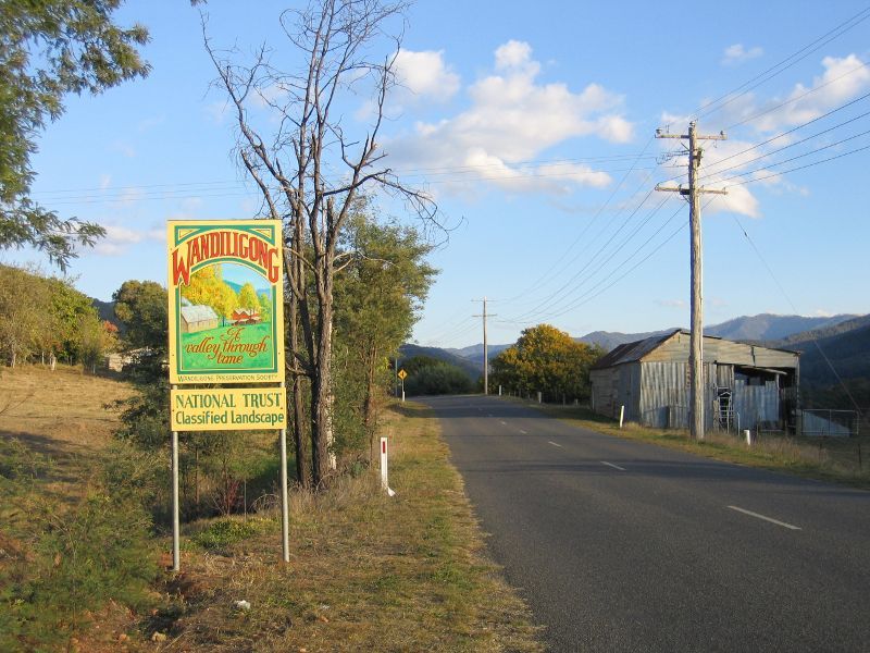 Wandiligong - Northern outskirts of Wandiligong: 'A valley through time' National Trust sign, view south along Morses Creek Rd