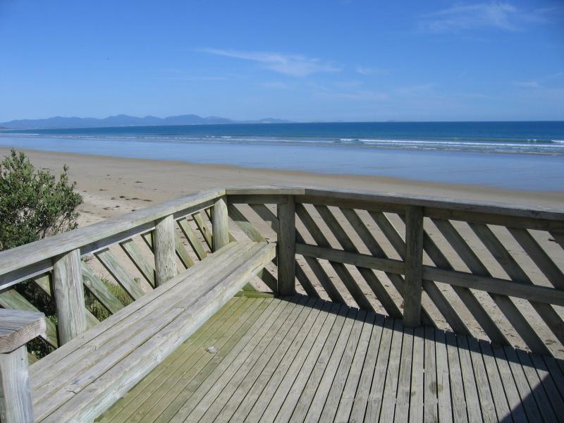 Waratah Bay - Beach, eastern end of town, Gale Street at Fish Creek Road: View from lookout, south-east towards the mountains of Wilsons Promontory