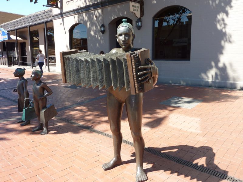 Werribee - Shops and commercial centre, Watton Street - Accordion Player & Shoppers sculpture outside Commercial Hotel, corner Watton St and Bridge St