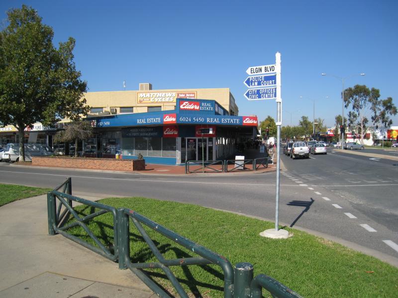 Wodonga - Shops along High Street south of railway line, Stanley Street and Woodland Grove - View south along High St at Elgin Bvd
