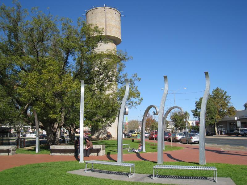 Wodonga - Shops along High Street south of railway line, Stanley Street and Woodland Grove: View south through Woodland Grove towards water tower