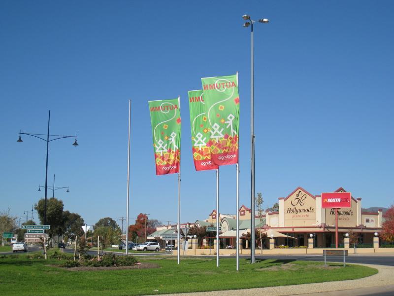 Wodonga - Shops along High Street south of railway line, Stanley Street and Woodland Grove: View south-east along Thomas Mitchell Dr at roundabout