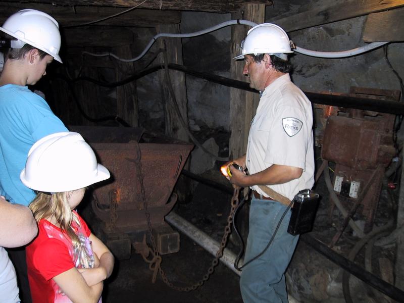 Wonthaggi - State Coal Mine Historic Reserve, East Area Mine, off Garden Street: The tourist guide shows visitors the mine