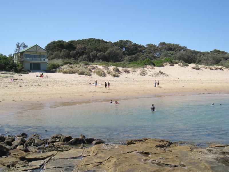 Wonthaggi - Cape Paterson, Bay Beach and boat ramp: View towards lookout tower from rock pool