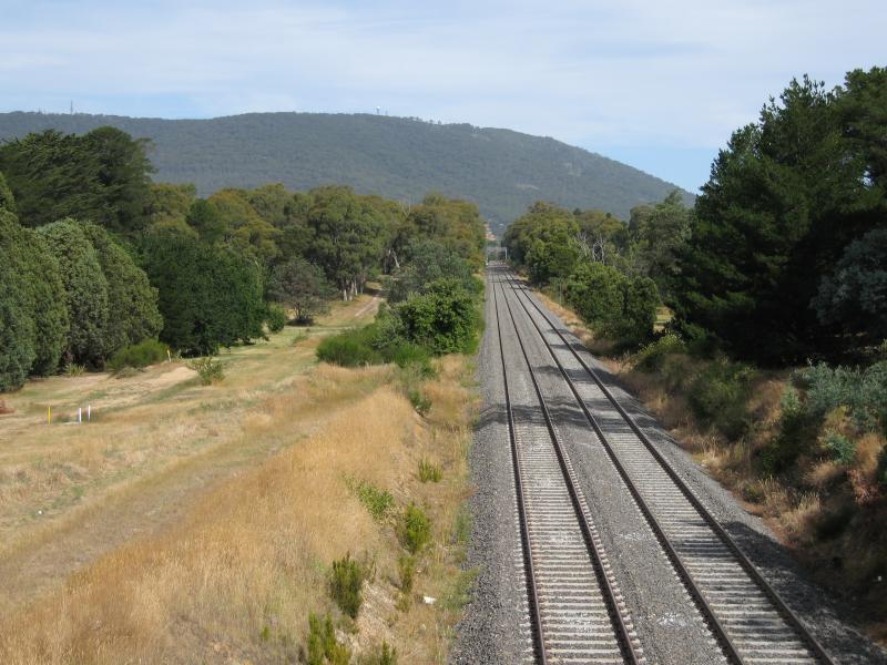 Woodend - Woodend railway station and surroundings: View south-east along railway line towards Mt Macedon from bridge at High St