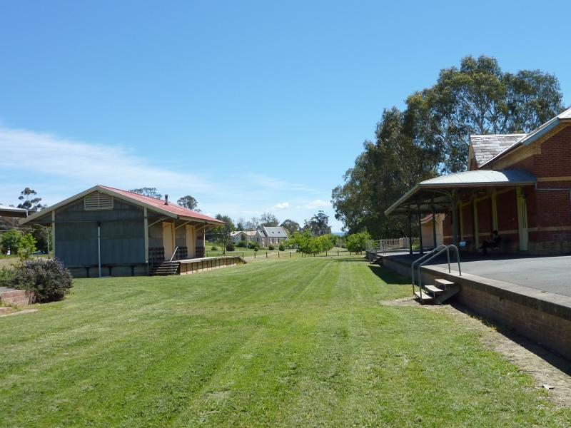 Yea - Former Yea railway station and surrounding parkland: View north-west along platform and lawns where railway tracks were