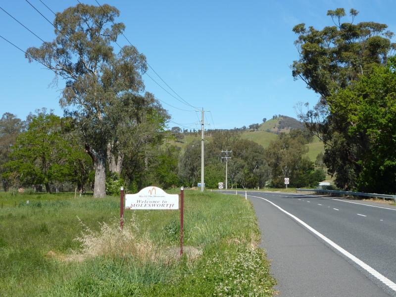 Yea - Town of Molesworth, Goulburn Valley Highway east of Yea - View east along Goulburn Valley Hwy towards town sign